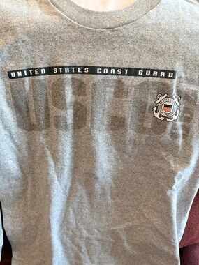 United States Coast Guard crewneck shirt featuring a printed logo. USA